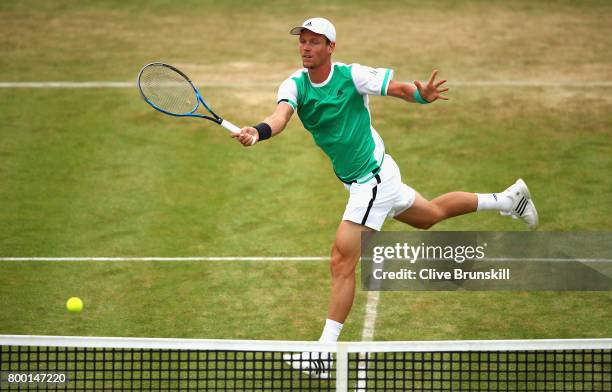 Tomas Berdych of The Czech Republic plays a volley during the mens singles quarter final match against Feliciano Lopez of Spain on day five of the...