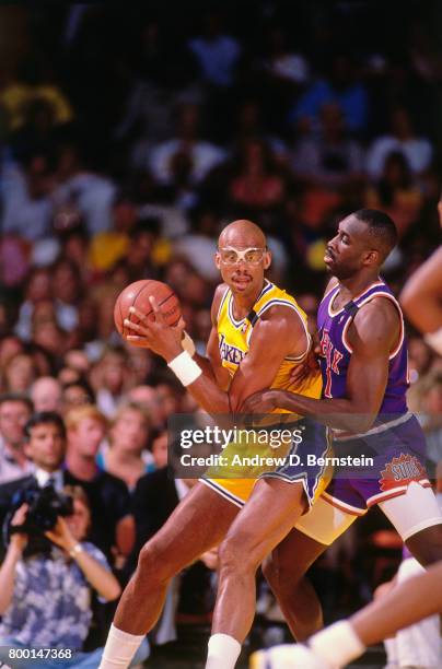 Kareem Abdul-Jabbar of the Los Angeles Lakers handles the ball during a game played circa 1989 at the Great Western Forum in Inglewood, California....