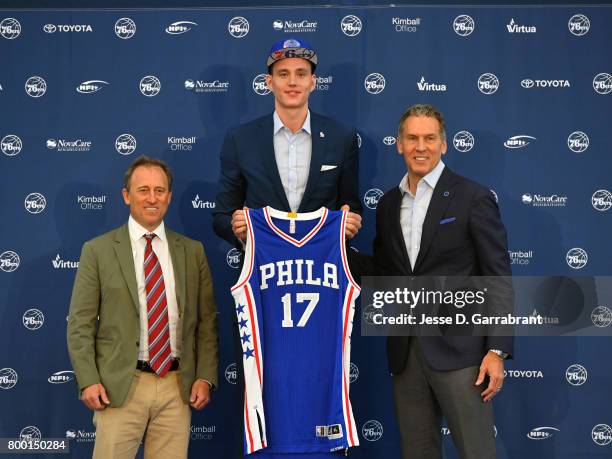 Joshua Harris and Bryan Colangelo of the Philadelphia 76ers introduce their new draftee Anzejs Pasecniks at the Sixers Training Complex on June 23,...