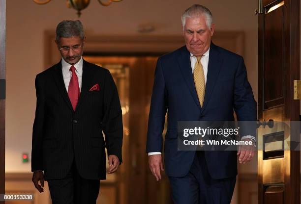 Secretary of State Rex Tillerson walks with Indian Foreign Secretary Subrahmanyam Jaishankar prior to their meeting at the State Department June 23,...