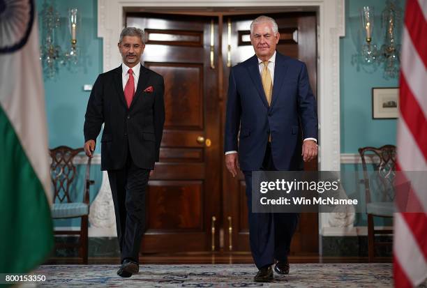 Secretary of State Rex Tillerson walks with Indian Foreign Secretary Subrahmanyam Jaishankar prior to their meeting at the State Department June 23,...