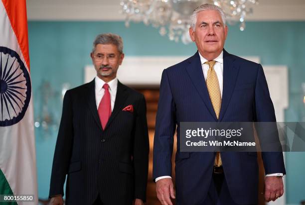 Secretary of State Rex Tillerson walks with Indian Foreign Secretary Subrahmanyam Jaishankar prior to their meeting at the State Department June 23,...