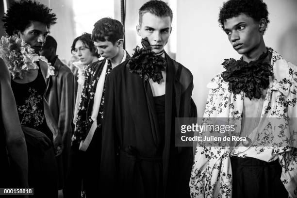 Models prepares backstage before the Ann Demeulemeester Menswear Spring/Summer 2018 show as part of Paris Fashion Week on June 23, 2017 in Paris,...