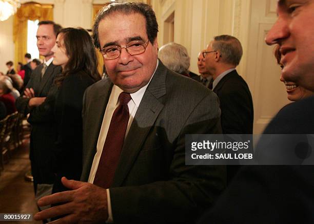Supreme Court Justice Antonin Scalia arrives for an event on the Picturing America Initiative in the East Room of the White House in Washington, DC,...