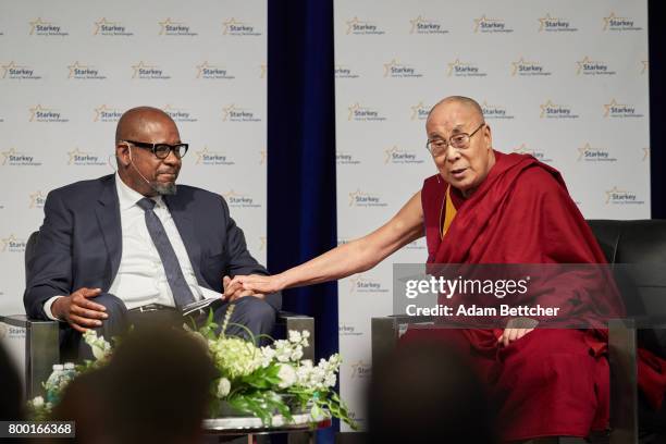 Forest Whitaker speaks with His Holiness the XIVth Dalai Lama and Starkey founder Bill Austin at the Starkey Hearing Foundation Center For Excellence...