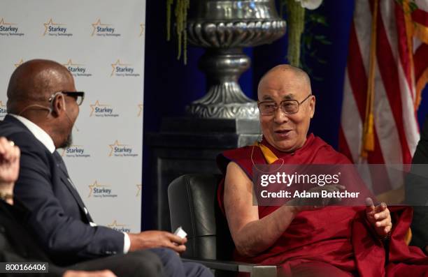 Forest Whitaker speaks with His Holiness the XIVth Dalai Lama and Starkey founder Bill Austin at the Starkey Hearing Foundation Center For Excellence...