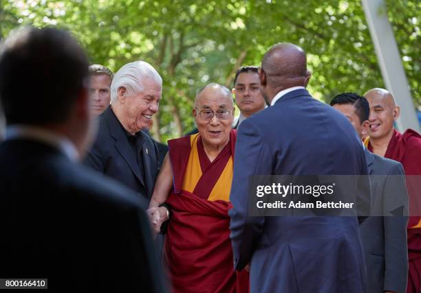 His Holiness the XIVth Dalai Lama greets Starkey founder Bill Austin, Tani Austin and Forest Whitaker at the Starkey Hearing Foundation Center For...