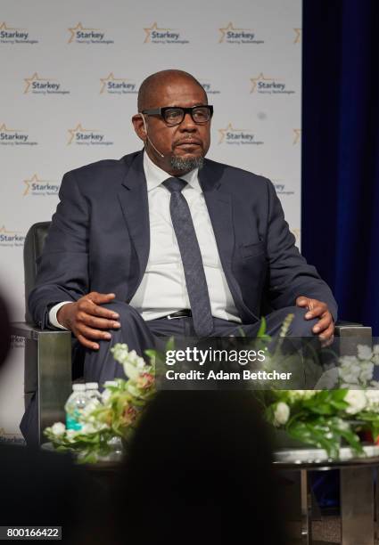 Forest Whitaker speaks with His Holiness the XIVth Dalai Lama and Starkey founder Bill Austin at the Starkey Hearing Foundation Center For Excellence...