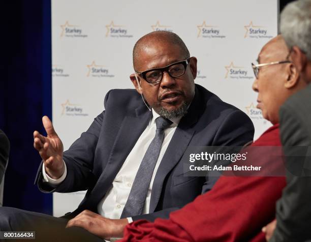 Forest Whitaker speaks with His Holiness the XIVth Dalai Lama and Starkey founder Bill Austin at the Starkey Hearing Foundation Center For Excellence...