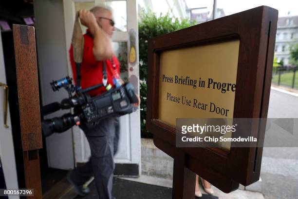 Sign asks people to use another door when White House Press Secretary Sean Spicer holds news conferences in the James Brady Press Briefing Room at...