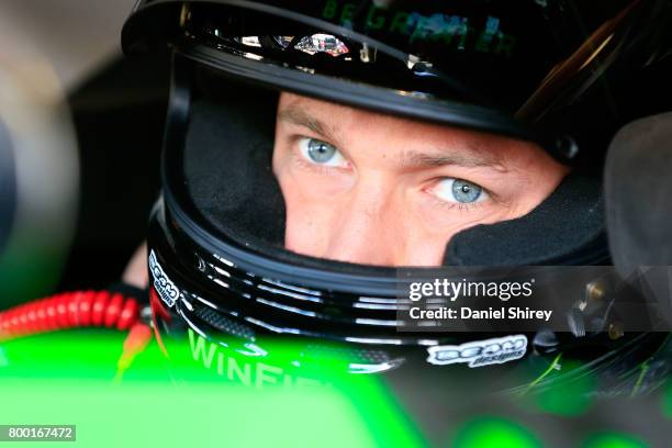 Dakoda Armstrong, driver of the WinField United Toyota, sits in his car during practice for the NASCAR XFINITY Series American Ethanol E15 250 at...