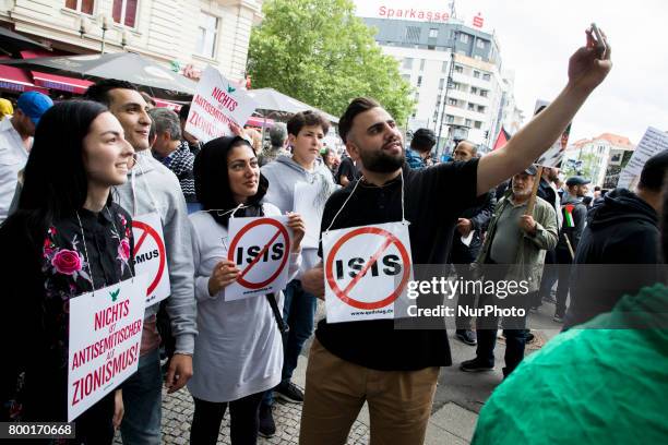 People attend an Al-Quds Demonstration in Berlin, Germany on June 23, 2016.