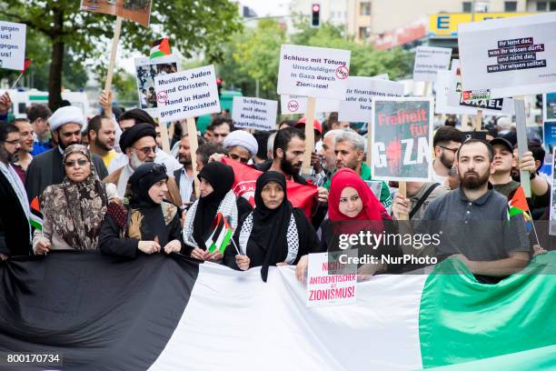 People carries a huge Palestinin flag during an Al-Quds Demonstration in Berlin, Germany on June 23, 2016.