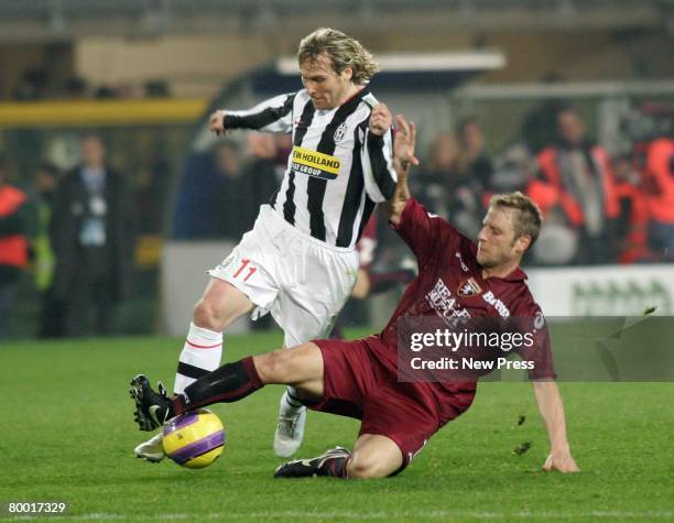 Vincenzo Grella of Torino clashes with Pavel Nedved of Juventus during the Serie A match between Torino and Juventus at the Stadio Olimpico on...