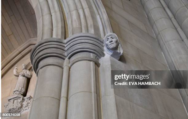 Figure of Catholic nun Mother Teresa, sculpted by Chas Fagan and carved by stonecarver Sean Callahan, appears inside the main entrance of the...