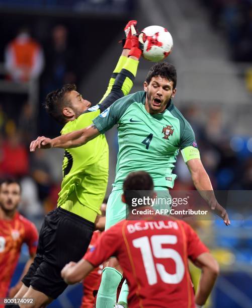 Macedonia's goalkeeper Damjan Siskovski saves the shot of Portugal's defender Tobias Figueiredo during the UEFA U-21 European Championship Group B...