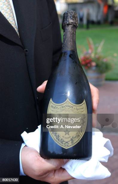 Clayton Dahlman, Dom Perignon Ambassador, displaying the vintage 1993 Dom Perignon served to GM and Bulgari guests