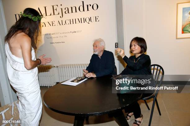 Alejandro Jodorowsky, Pascale Montandon-Jodorowsky and guest "Jesus" attend the "pascALEjandro: L'Androgyne Alchimique" Exhibition's Book Signing at...