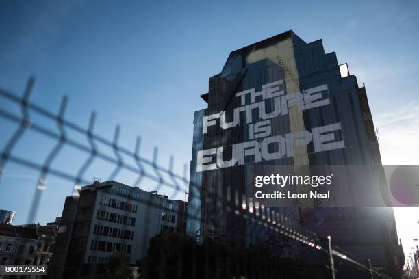 Street art reading "The Future Is Europe" is seen on the side of building near to the European Council headquarters on June 23, 2017 in Brussels,...