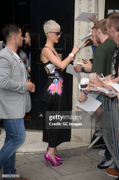 Katy Perry greets fans outside Kiss FM Studios on June 23, 2017 in London, England.