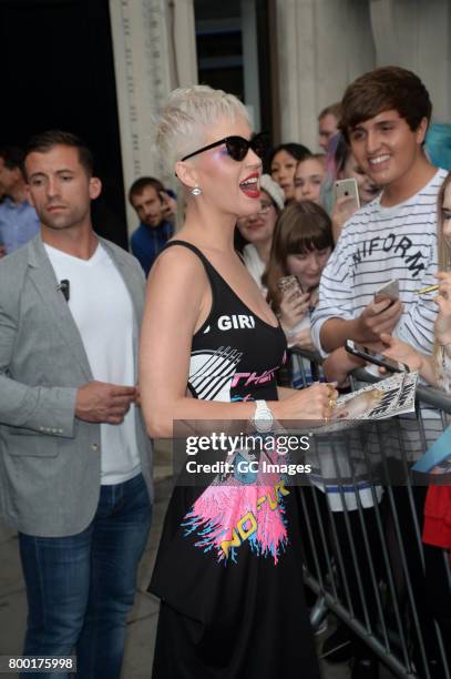 Katy Perry greets fans outside Kiss FM Studios on June 23, 2017 in London, England.