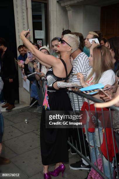 Katy Perry greets fans outside Kiss FM Studios on June 23, 2017 in London, England.