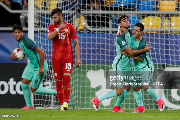 Daniel Podence of Portugal celebrates with team mates after scoring his team's third goal during the UEFA European Under-21 Championship Group B...