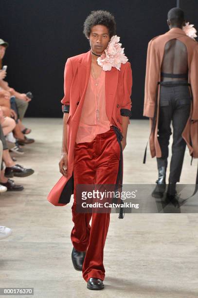 Model walks the runway at the Ann Demeulemeester Spring Summer 2018 fashion show during Paris Menswear Fashion Week on June 23, 2017 in Paris, France.