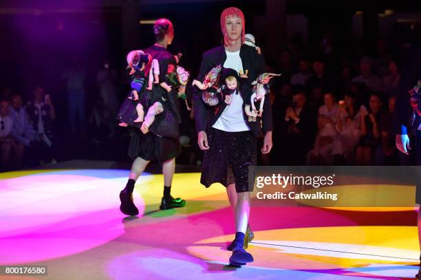 Models walk the runway at the Comme des Garcons Homme Plus Spring Summer 2018 fashion show during Paris Menswear Fashion Week on June 23, 2017 in...