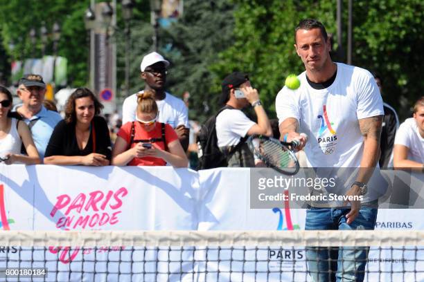 Swimmer Frederic Bousquet plays tennis on Alexandre III bridge as Paris promotes its candidacy for the 2024 Summer Olympic and Paralympic Games on...