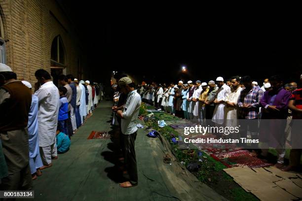 Kashmiri Muslims offer prayers during the special night prayers on the 27th night of the holy fasting month of Ramadan known as 'Shab-e-Qadr' or...