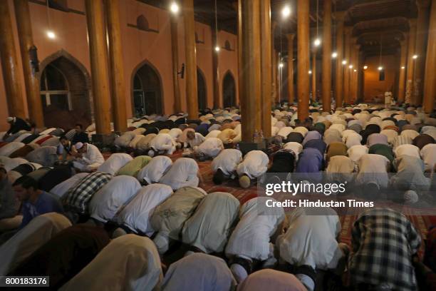 Kashmiri Muslims offer prayers during the special night prayers on the 27th night of the holy fasting month of Ramadan known as 'Shab-e-Qadr' or...