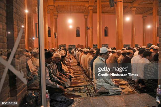Kashmiri Muslims offer prayers during the special night prayers on the 27th night of the holy fasting month of Ramadan known as 'Shab-e-Qadr' or...