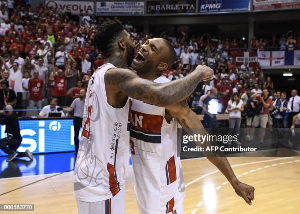 Chalon's US Cameron Clark and US Lance Harris celebrate at the end of the Pro A basketball game 5 of the final match between Chalon and Strasbourg on...