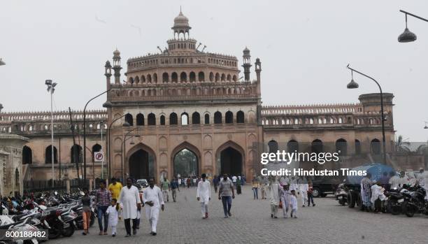 People crossing Rumi Darwaza to attend Alvida Namaz at Bara Imambara in Lucknow, India, on Friday, June 23, 2017.