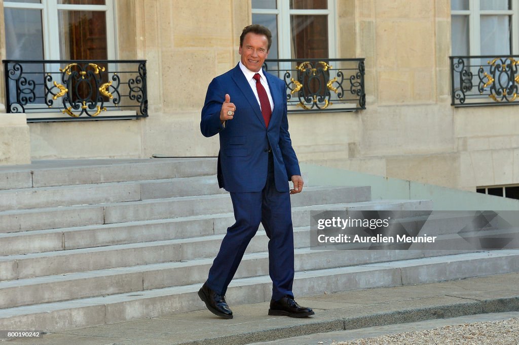 French President Emmanuel Macron Receives Arnold Schwarzenegger At Elysee Palace