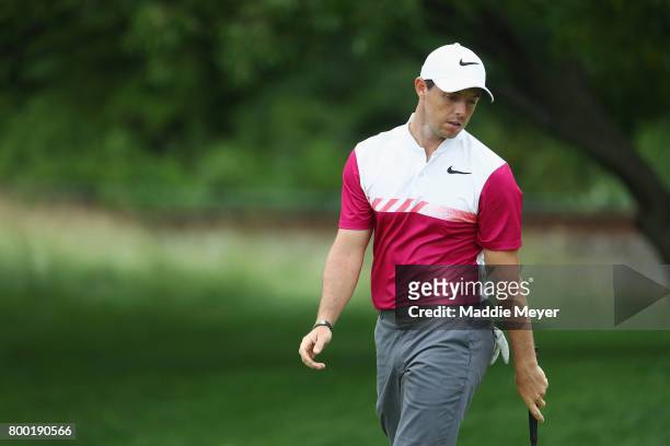 Rory McIlroy of Northern Ireland reacts after putting on the 13th green during the second round of the Travelers Championship at TPC River Highlands...
