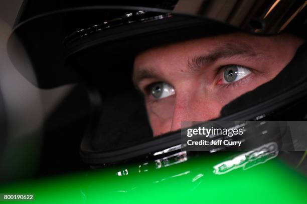 Dakoda Armstrong, driver of the WinField United Toyota, looks on in the garage during practice for the NASCAR XFINITY Series American Ethanol E15 250...