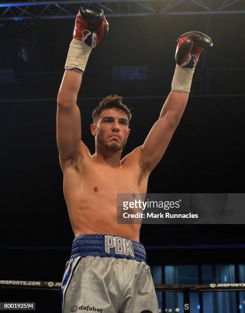 Josh Kelly celebrates after beating Tom Whitfield during a Welterweight contest presented by Matchroom Boxing at Walker Activity Dome on June 23,...