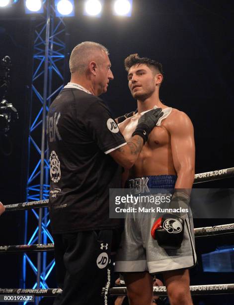 Josh Kelly receives congratulations from a trainer after beating Tom Whitfield during a Welterweight contest presented by Matchroom Boxing at Walker...