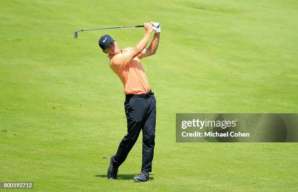 Brian Henninger hits his second shot on the 18th hole during the first round of the American Family Insurance Championship held at University Ridge...