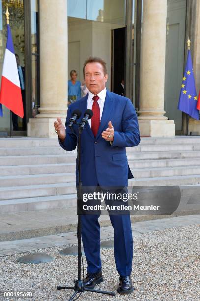 Arnold Schwarzenegger addresses the press as he leaves after meeting French President Emmanuel Macron at the Elysee Palace on June 23, 2017 in Paris,...