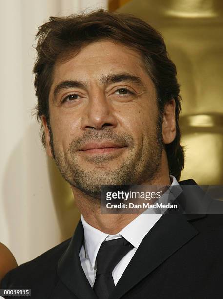 Actor Javier Bardem poses with his award for Best Performance by an Actor in a Supporting Role in the press room during The 80th Annual Academy...