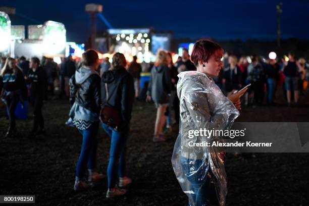 Festival goer tries to call her friend during the Hurricane Festival 2017 on June 23, 2017 in Scheessel, Germany. The gates of the festival have...