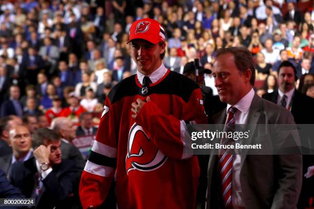 Nico Hischier walks off the floor after being selected first overall by the New Jersey Devils during the 2017 NHL Draft at the United Center on June...