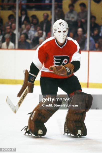 Bernie Parent of the Philadelphia Flyers tends goal in game against the Boston Bruins at Boston Garden.