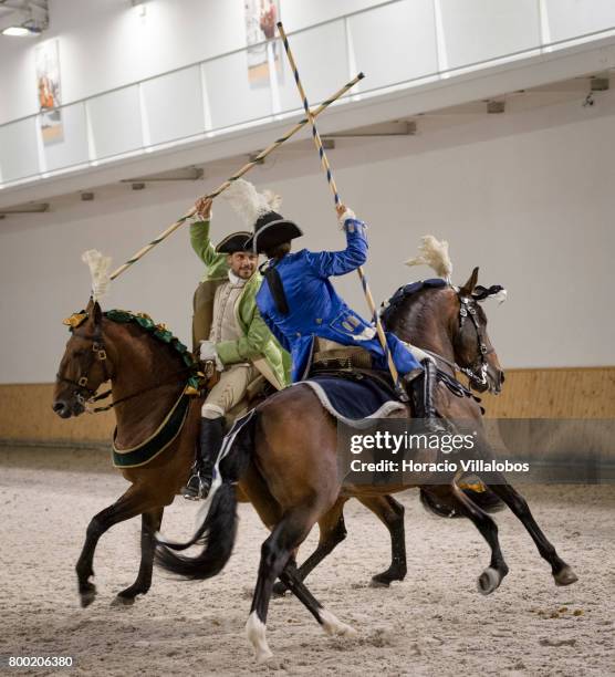Portuguese School of Equestrian Art riders demonstrate the use of lances and sabres during a gala at Henrique Calado riding ring after the...