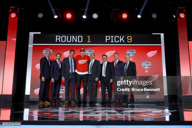 Michael Rasmussen poses for photos after being selected ninth overall by the Detroit Red Wings during the 2017 NHL Draft at the United Center on June...