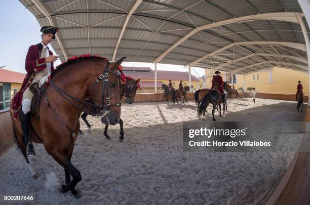Riders and horses warm up at Portuguese School of Equestrian Art new installations of Pateo de Nora stables on May 17, 2017 in Lisbon, Portugal. The...