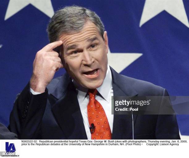 Republican presidential hopeful Texas Gov. George W. Bush jokes with photographers, Thursday evening, Jan. 6 prior to the Republican debates at the...